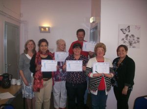 Ready to go: the second group of volunteers receive their certificates from trainers Kim (left) and Vicky (right)