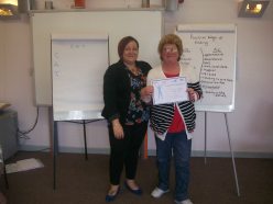 Christine receiving her certificate from Volunteer Development Officer Vicky